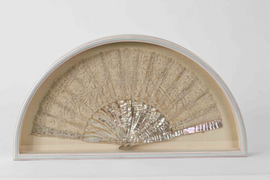 CONTINENTAL SCHOOL, LATE 19TH CENTURY : CONTINENTAL SCHOOL, LATE 19TH CENTURY A lace fan on mother-of-pearl sticks, 10" x 19" (25.5cms x 48cms). (1).