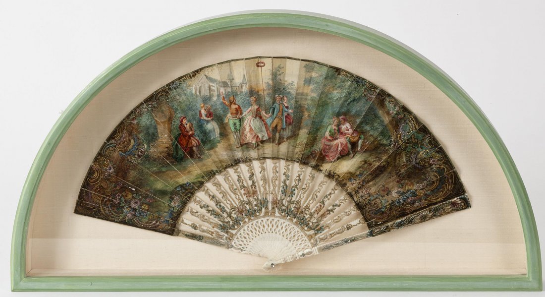 18TH CENTURY CONTINENTAL SCHOOL: 18TH CENTURY CONTINENTAL SCHOOL A painted fan depicting dancers in a wooded landscape with church in background, gouache on paper and painted ivory sticks, 9 ½” x 18" (24cms x 46cms). (1).