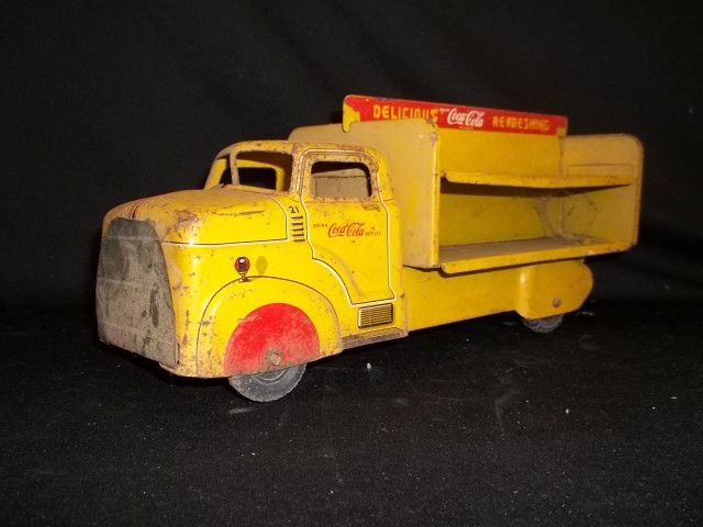 Antique Marx Coca-Cola Delivery Truck: Old Marx Coca-Cola delivery truck, with some oxidation marks, and scratches. We have not cleaned it up, but it would shine quite a bit more once the dust and dirt are removed. Marked Marx on the under