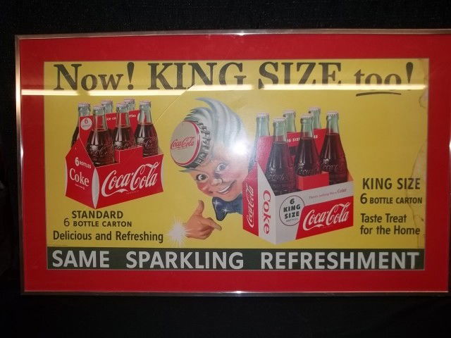 Antique 1955 Sprite Boy Coca-Cola Advertising Sign: Super rare 1955 Sprite Boy Coca-Cola advertising thick carboard sign. Framed and matted measures 40 x 24 with a crack in the glass frame, and some water damage on the side of sign.