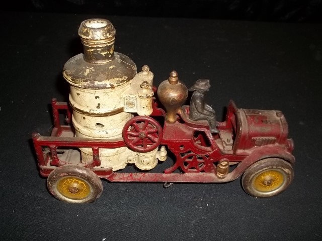 Antique Cast Iron Fire Truck Toy: Nice old antique cast iron fire truck measuring 12 inches. Very tough to find, dont miss out.
