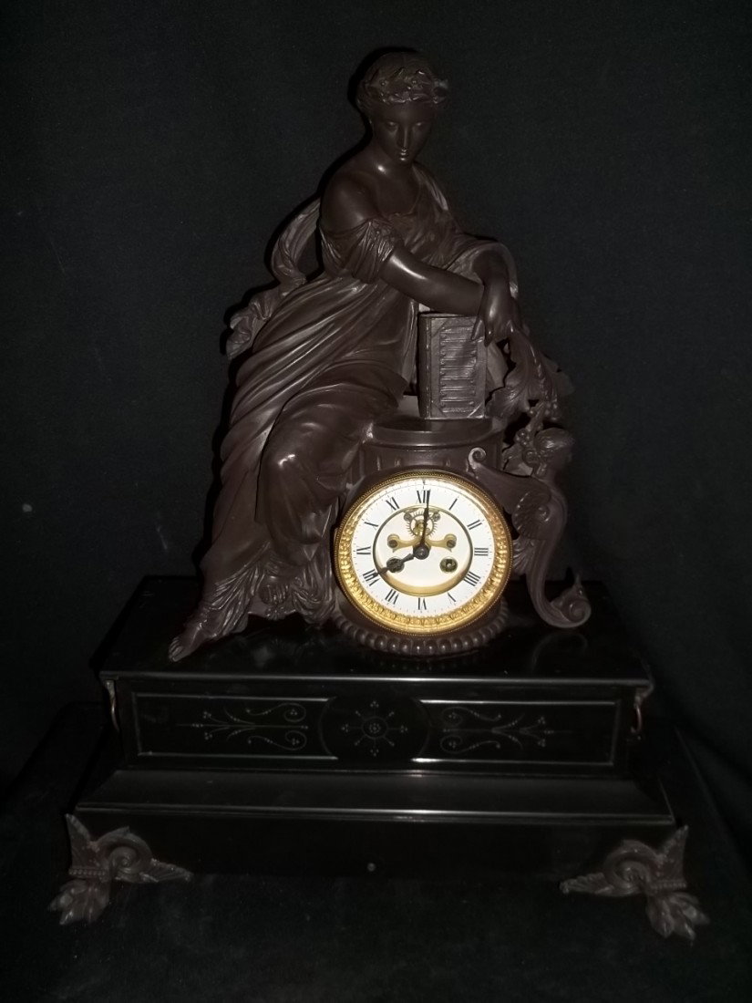 Antique figural Clock W Gargoyles: Nice antique figural clock with gargoyles on the side. Chipped paint on back, 24 x 17.5. This clock is a keywind, key not included but you can usually get a key for a couple of dollars. The rear leg h