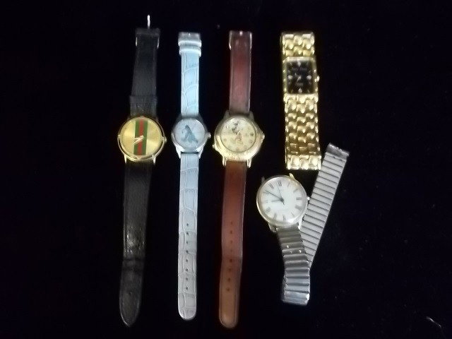 Lorus Mickey Mouse Timex Eeyore Watch Lot: Lot of 5 watches, one eeyore winnie the pooh watch needs battery, one lorus disney mickey mouse watch with cracked open face not sure if it works, one older timex not sure if it works, and two other w