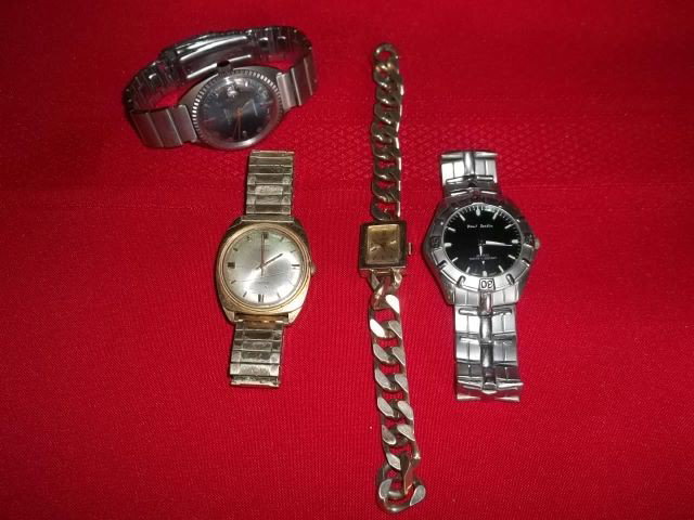 4 Watch Lot Lloyd: 4 watch lot with 1 Lloyd, Paul Jardin, Timex, and swank. Lloyd and swank work, other two may need batteries, some scratches etc on watches
