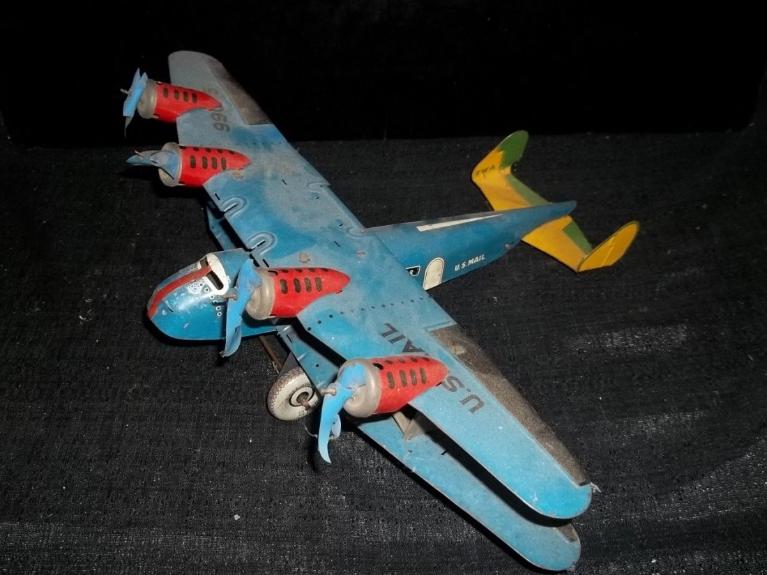 Old Marx US Mail Tin Airplane TWA: Old Marx TWA US mail airplane, tin, 13 inches, plastic props are chipped up and not much left of them.