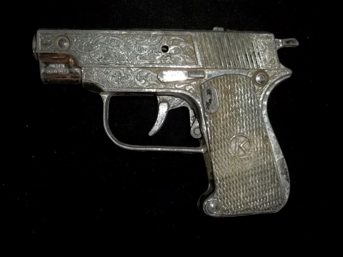 4 Inch Cap Gun: 4 inch cap gun with a circled k on side grip, trigger stuck, a little rough.