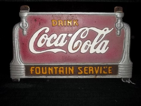 Old Coca-Cola Fountain Service Cast Iron Sign: Old Coca-Cola fountain service cast iron sign measuring 20 x 11, appears to be repainted.