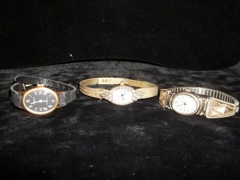 3 Gruen Clinton Times Square Vintage Watch Lot: 3 Vintage watch lot. One gruen needs battery, one clinton 17 winds and works nicely with rough leather band, and one times square shell inlay needs battery and no face.