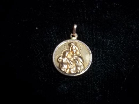 Older Catholic Pendant Gold? Silver?: Older catholic pendant, cant find a mark, looks like gold but we are not sure so bid accordingly
