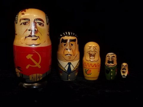 Unusual Communist Nesting Dolls Gobachev Hussein: 5 Communist and such Nesting Dolls range from 2-7 inches, all are hand painted and wood, dictators, etc. with Sadaam Husein as well.