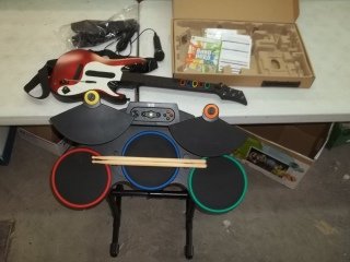 Xbox 360 Guitar Hero Band Hero Set NEW IN BOX: Xbox 360 Guitar Hero Band Hero set in box, everything is new, you get the game, guitar, drums, mic, foot pedal, and accessories as well as the guides.