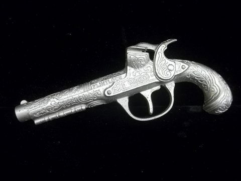 50s Hubley Flintlock Midget Cap Gun: This vintage Hubley cap gun is in excellent shape with no cap burns or residue on the trigger pad. Great detail on this hard-to-find gun. Cowboy guns were all the rage in the 1950s, so this was an und