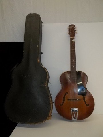 Vintage Silvertone Acoustic Guitar w Ess Case: 41 inch, appears to be in decent shape, no apparent cracks and breaks, apparently an archback, also comes with Ess & Ess Aligator exterior case