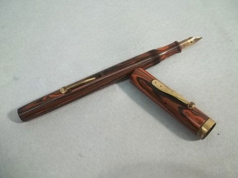 Old Watermans Ideal Fountain Pen: Nib says "Waterman's Ideal reg. us pat. off 2" Tried to pump it with water and seemed to pull the water in and then write with old ink left inside, but unsure if it does indeed pump and work. Pen is i