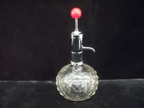 Park Sherman Liquor Decanter: A vintage decanter also acts as a push dispenser with red wood knob