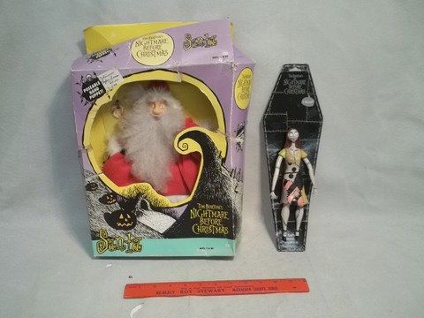 2 Tim Burton Nightmaret Before Christmas Figures: Santa Puppet unsued but box in very worn shape from the original series in 1993, the Sally figure believed produced later, she's mint on the card.