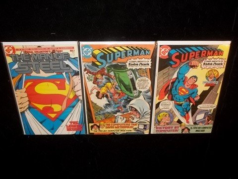 #1 Superman & 2 Radio Shack Superman PREMIUMS: Near mint range, Superman No. 1 by John Byrne from late 80s and two other 80s Radio Shack only premiums.