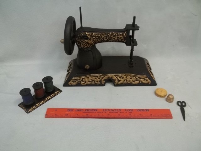 Cast Sewing Machine Doorstop: .