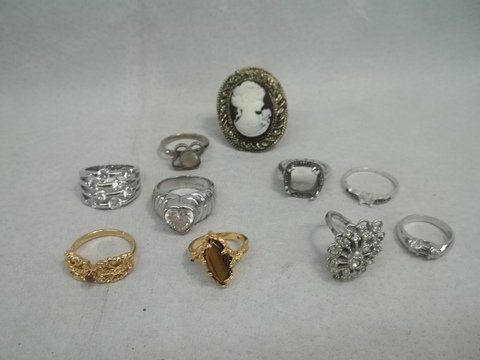 10 Rings Ruby Tiger Eye 4 R Sterling Silver: the four that are sterling silver are on the right and are missing stones