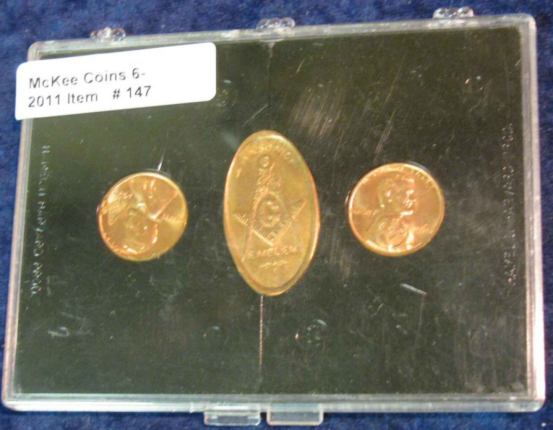 147. Set of Three Masonic Pennies. BU. One embosse: 147. Set of Three Masonic Pennies. BU. One embossed, one elongated, and the last Counterstamped. All in a display case.