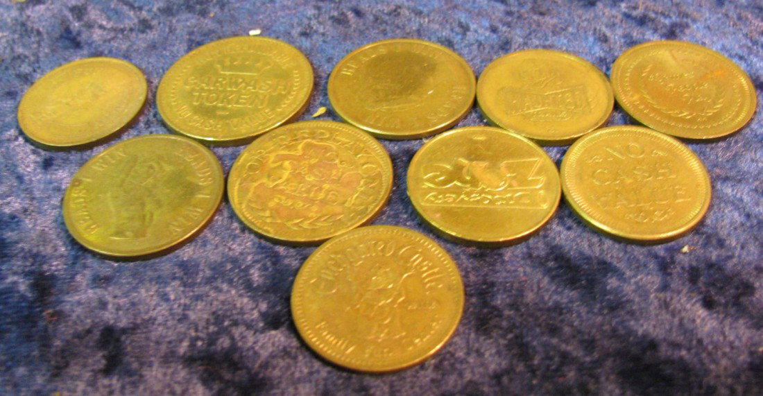 360. (10) Various Amusement & Novelty Tokens including : 360. (10) Various Amusement & Novelty Tokens including a nude Woman flipping coin..