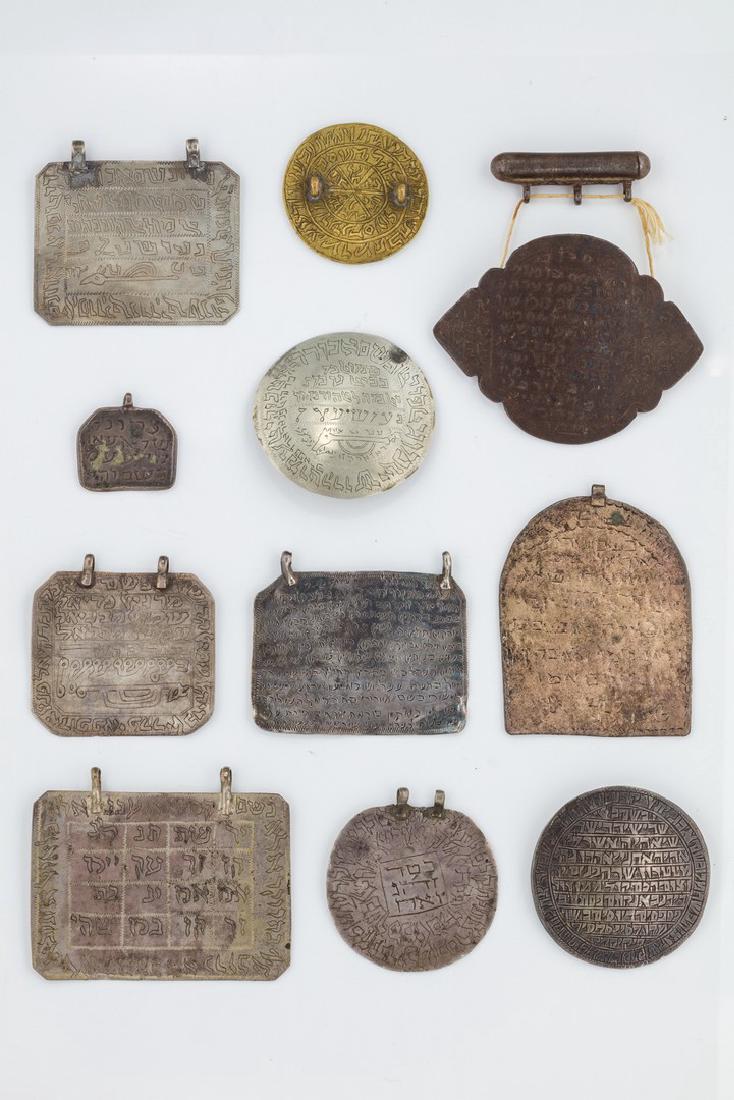 A COLLECTION OF ELEVEN AMULETS. Middle Eastern, (1 of 1)