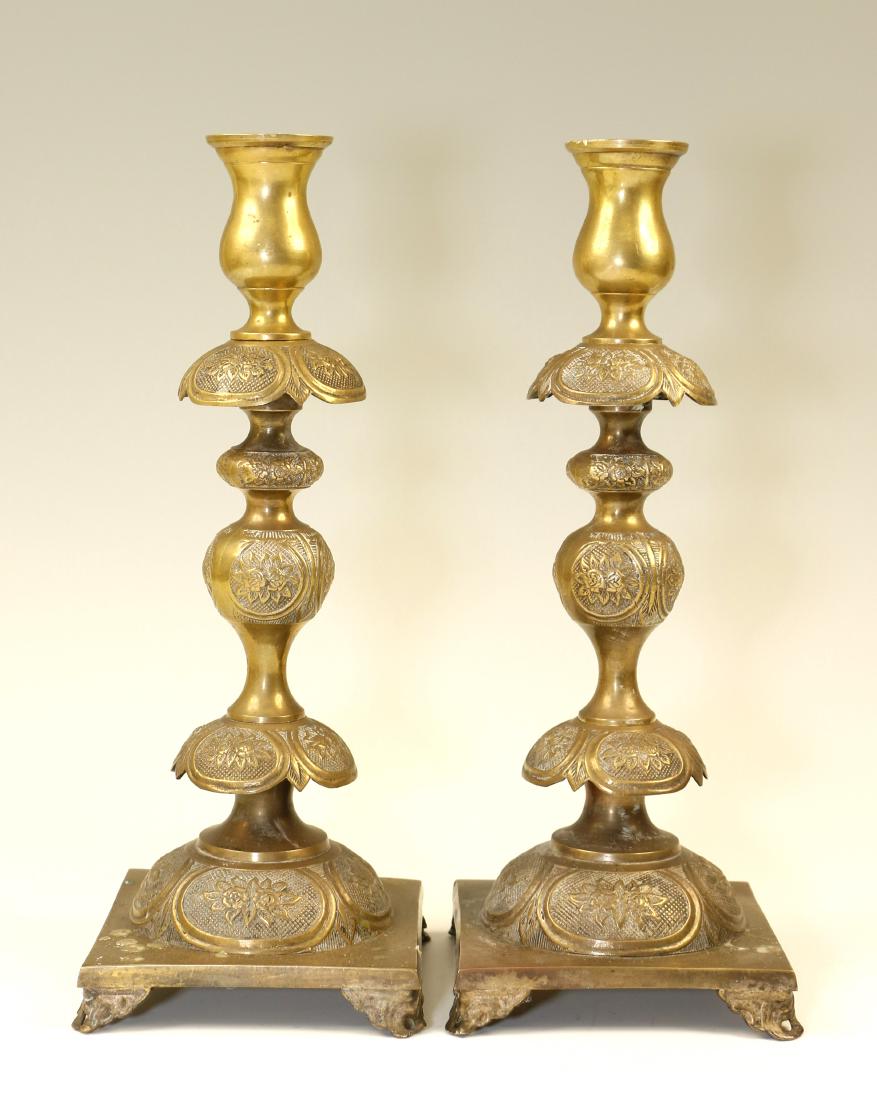 68. A LARGE PAIR OF BRASS SABBATH CANDLESTICKS. Warsaw, (1 of 1)