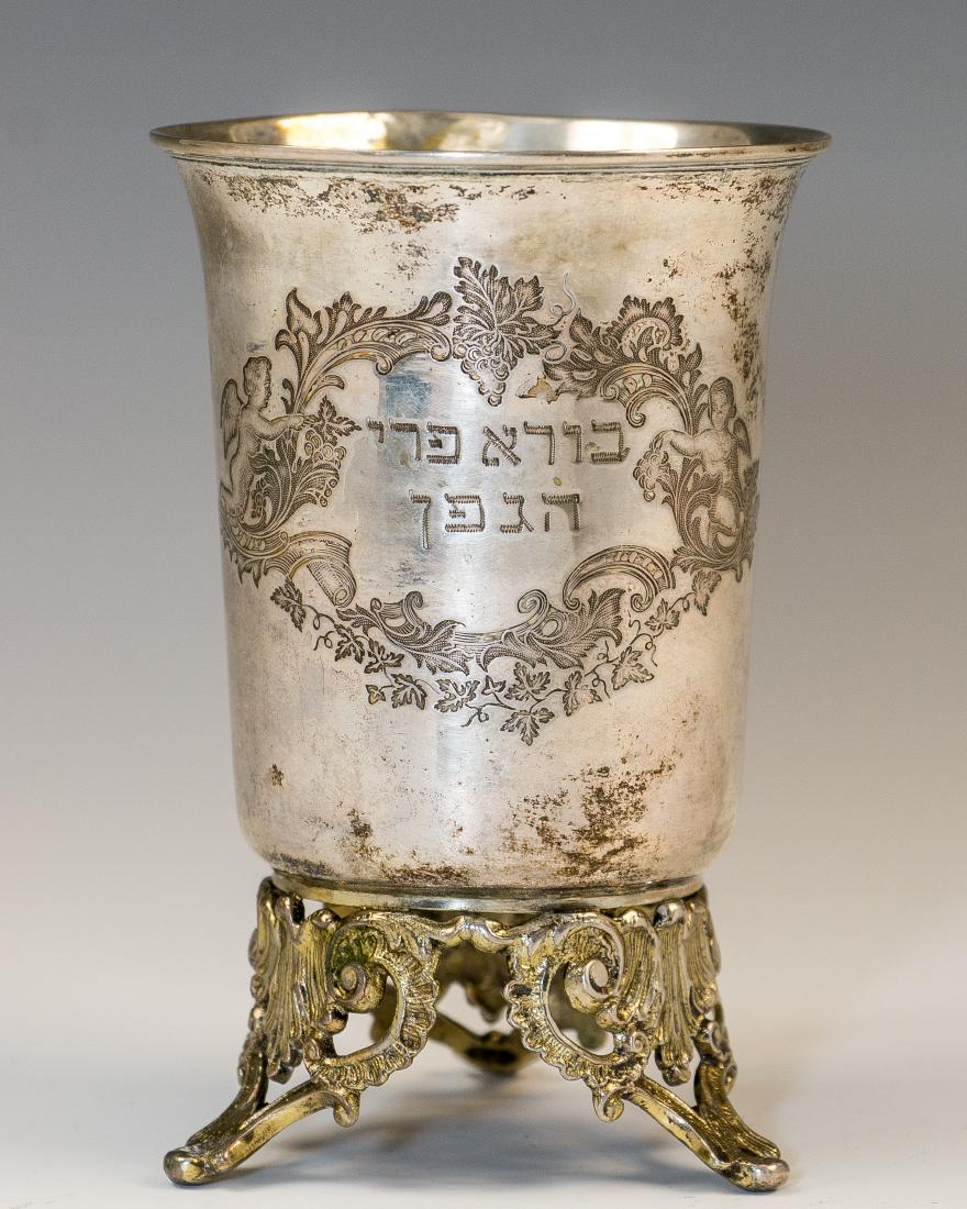 A SILVER KIDDUSH BEAKER. Germany, c. 1900. On three (1 of 1)