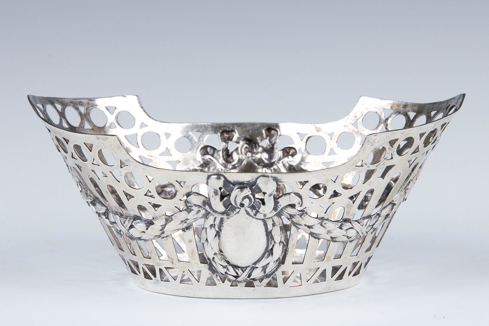 A SILVER BASKET. Germany, 19th century. Oval in shape (1 of 3)
