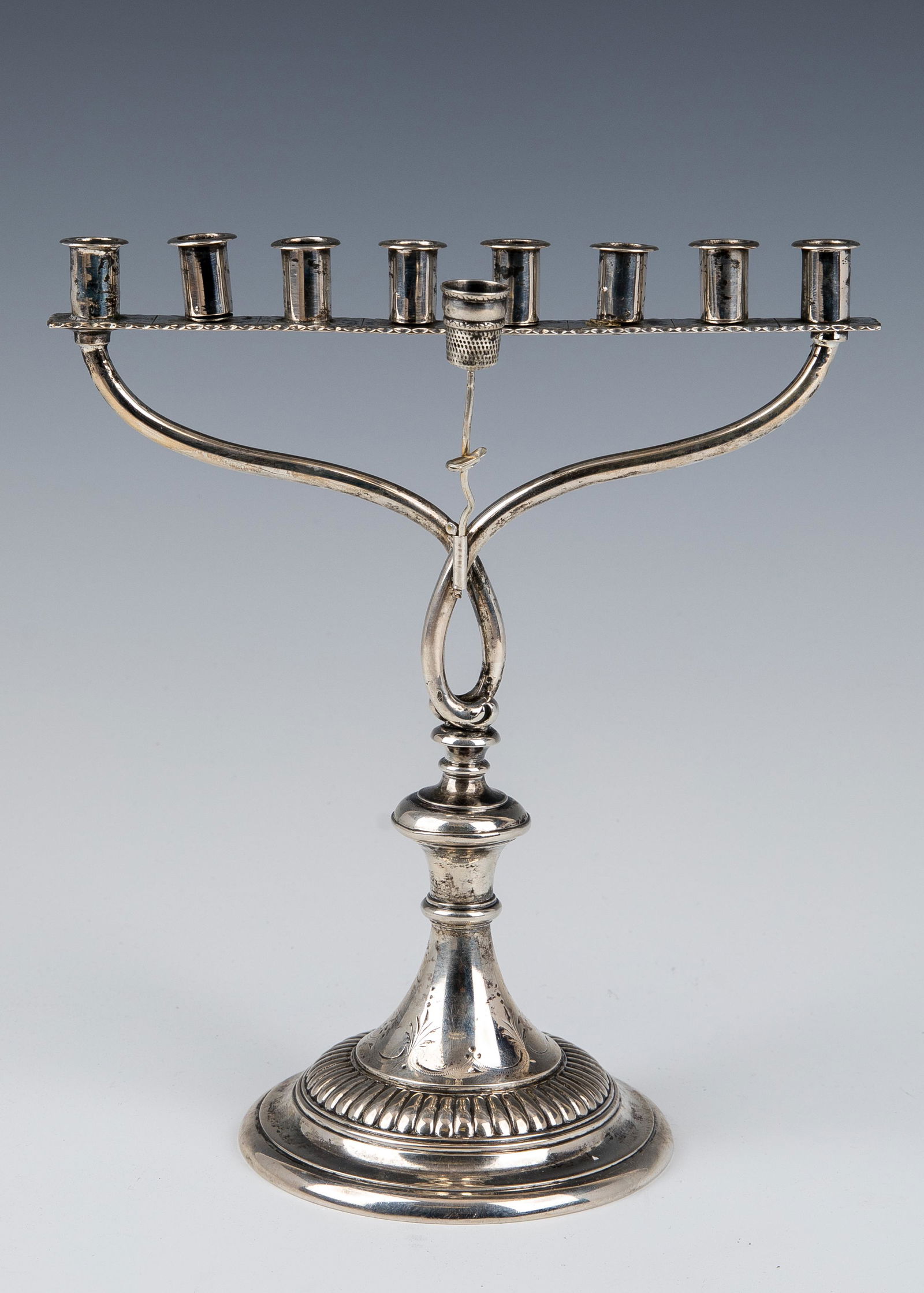 A SILVER HANUKKAH MENORAH. Vienna, c. 1910. On round (1 of 3)