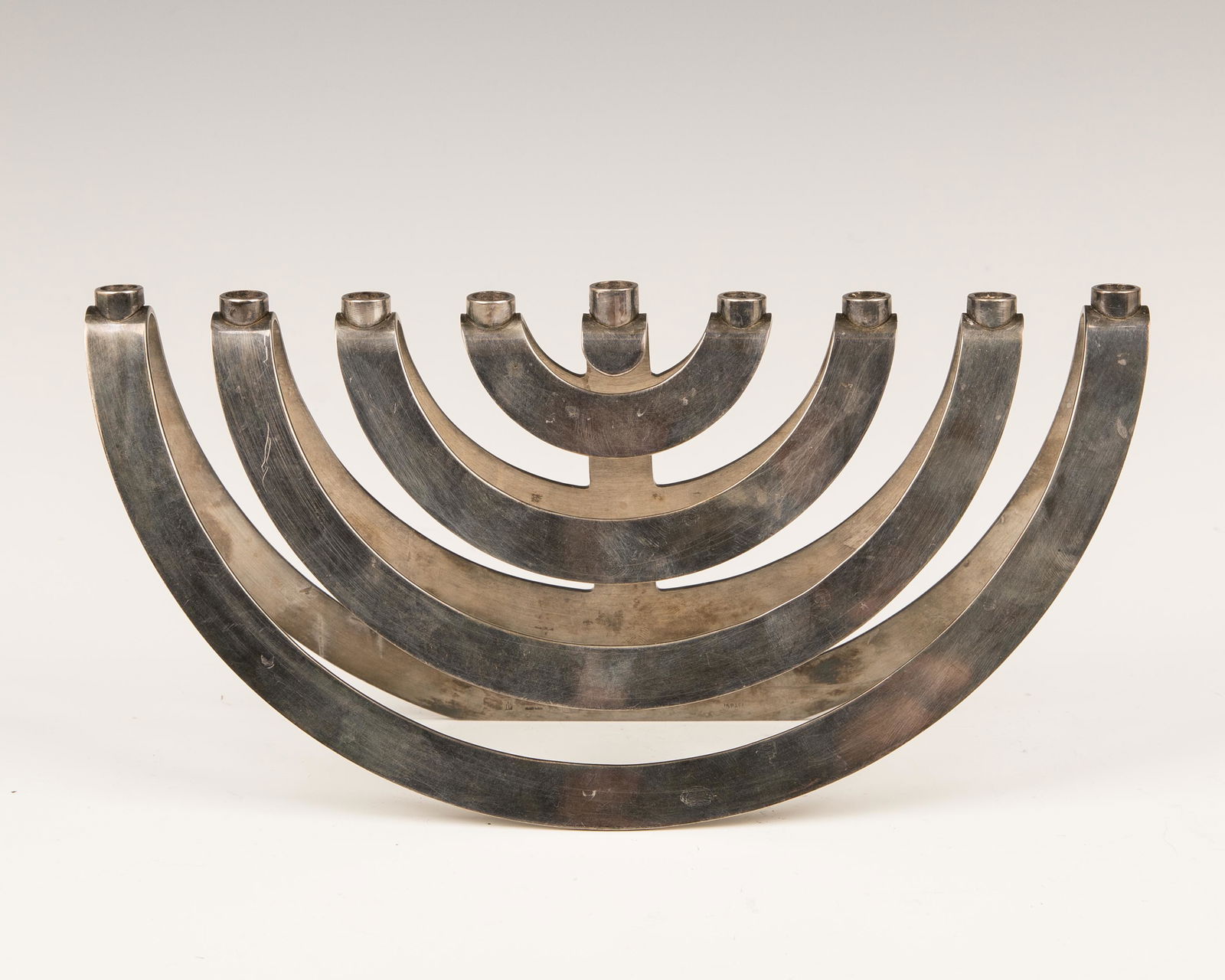 A SILVER PLATED HANUKKAH MENORAH BY EMIL KRASOWSKI. (1 of 1)