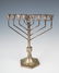 AN ART DECO SILVER MENORAH. Poland, c. 1920. On a six