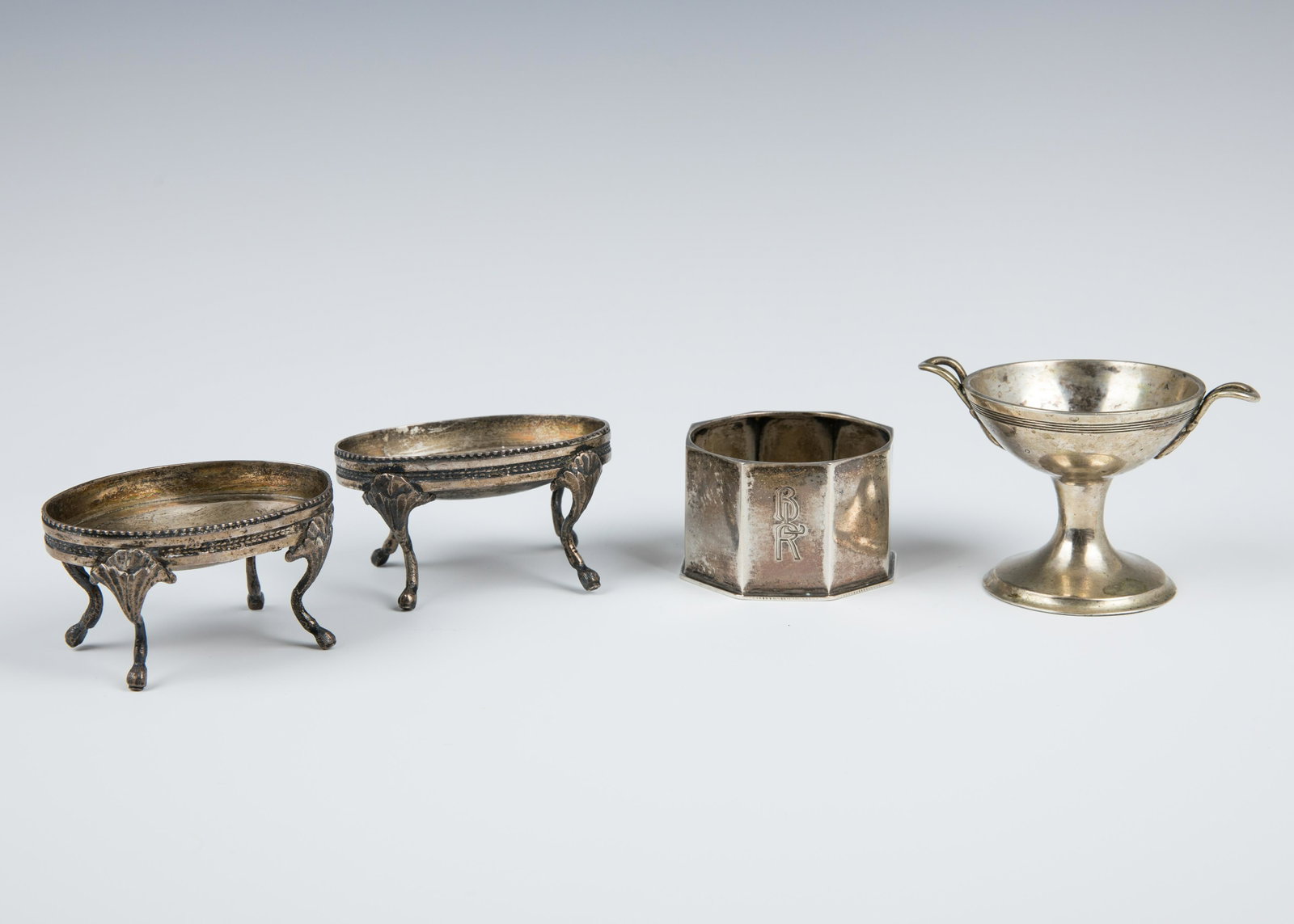 16. A GROUP OF FOUR SILVER SALT CELLARS. Austria, first: 16. A GROUP OF FOUR SILVER SALT CELLARS. Austria, first half 19th century. Two with matching oval shapes, one pedestal and one eight sided. 296 grams.
