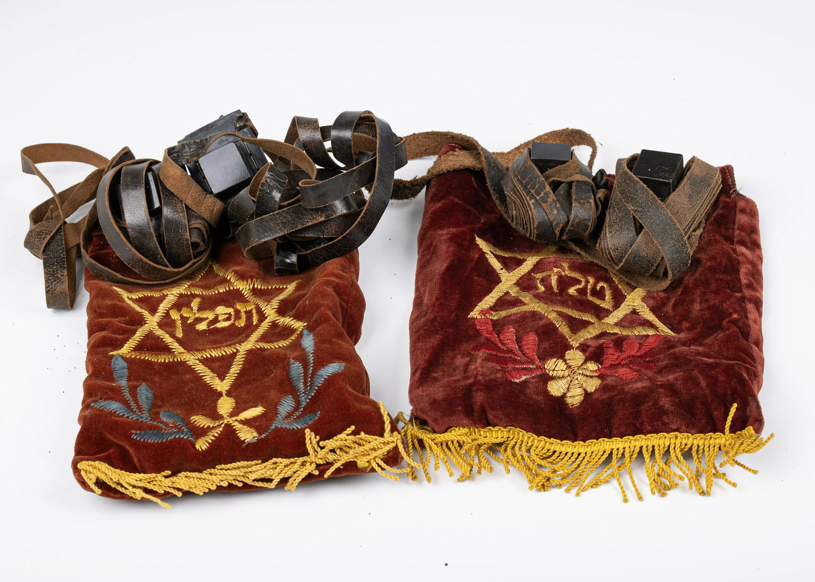 56. TWO PAIRS OF ANTIQUE TEFILLIN IN THE ORIGINAL BAGS.: 56. TWO PAIRS OF ANTIQUE TEFILLIN IN THE ORIGINAL BAGS. Eastern Europe, c. 1900. In traditional form.