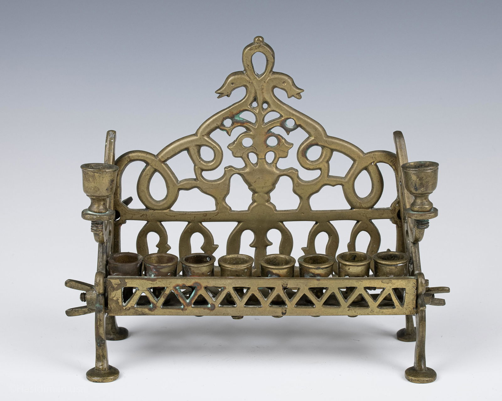 76. AN EARLY BRASS HANUKKAH LAMP. Poland, c. 1840. On (1 of 1)