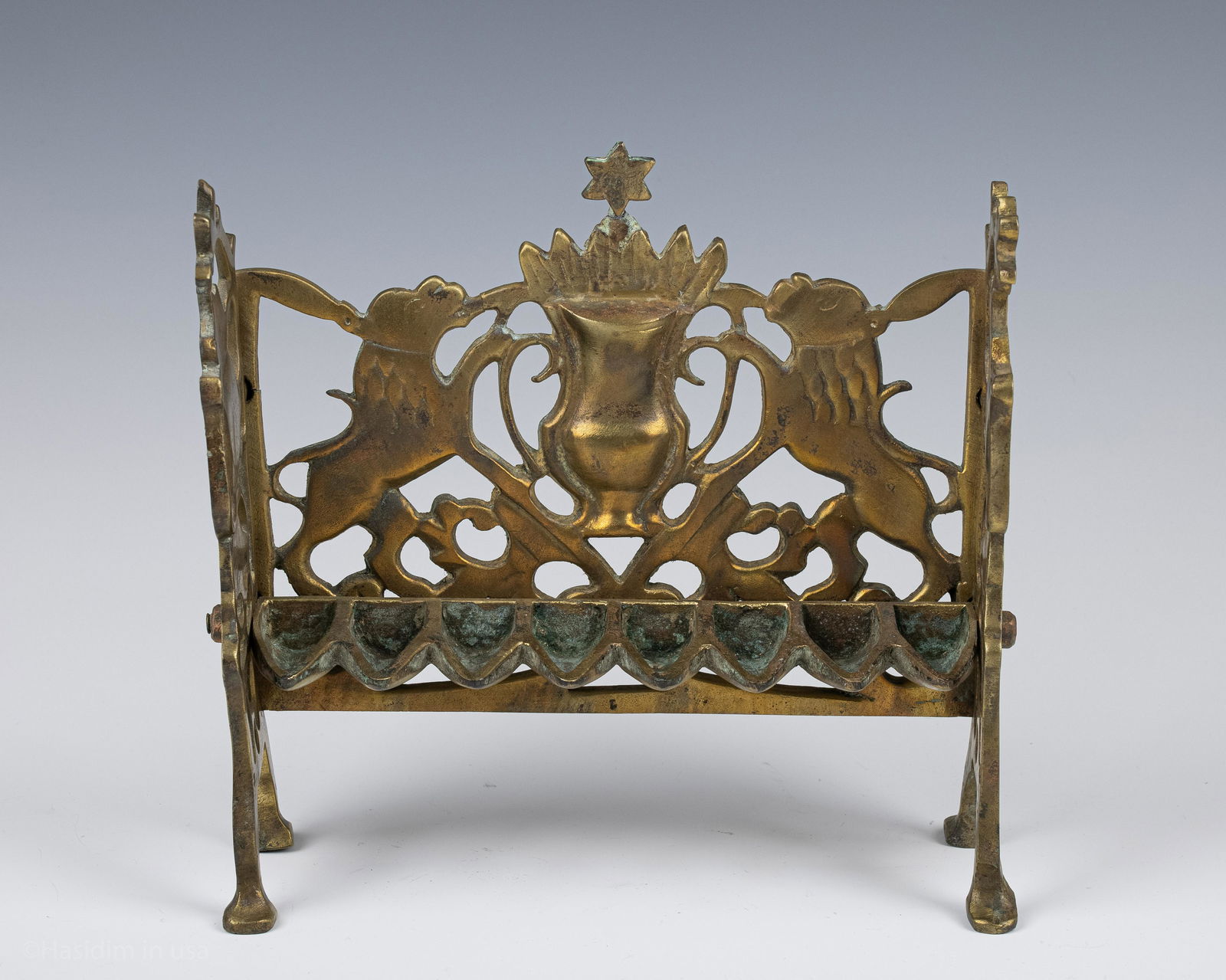 77. AN EARLY BRASS HANUKKAH LAMP. Poland, c. 1840. On (1 of 1)