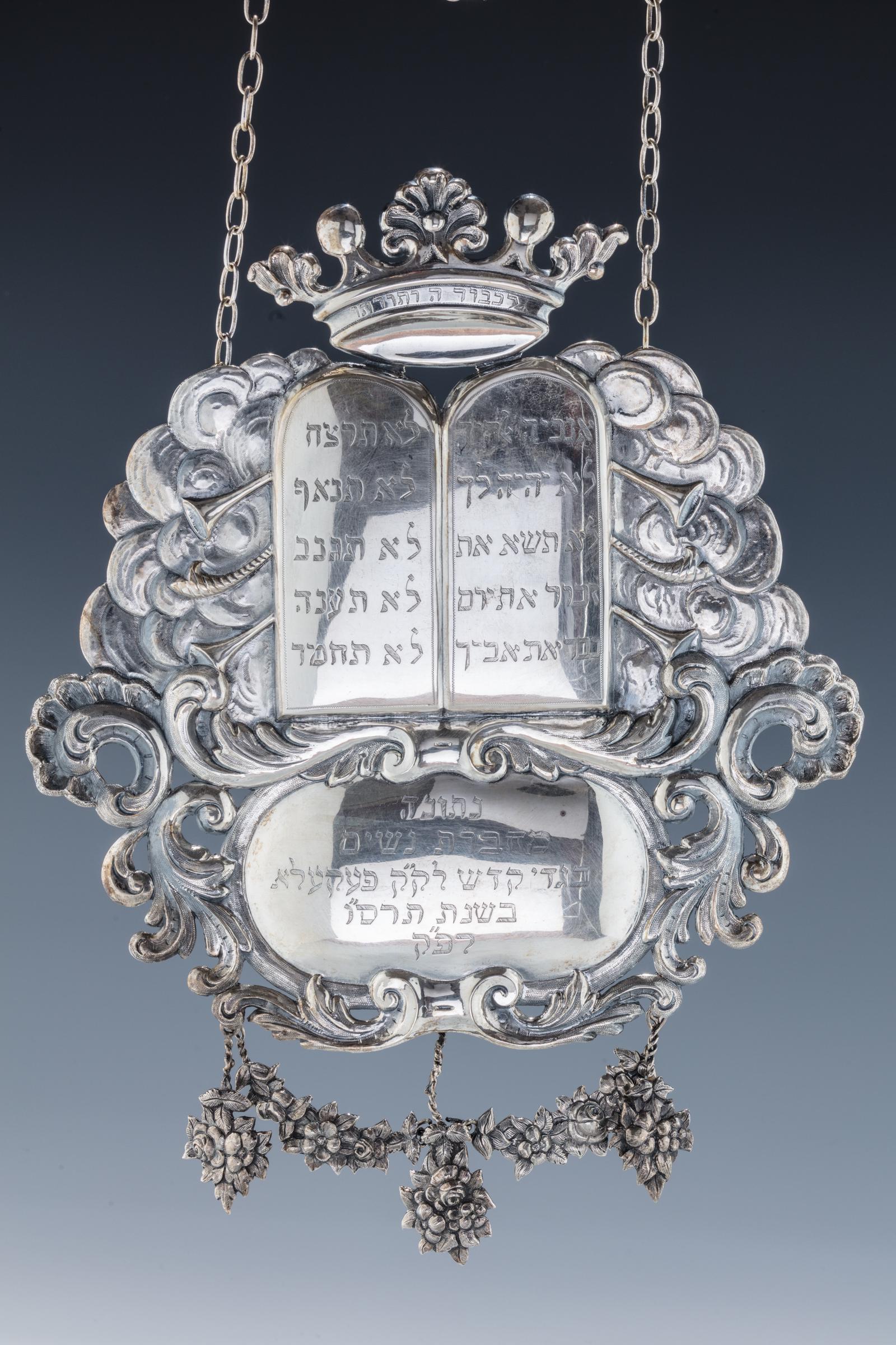 A LARGE SILVER TORAH SHIELD BY R AND J WEERING.: A LARGE SILVER TORAH SHIELD BY R AND J WEERING. Groningen, 1902 - 1906. Chased with a cloud-like formation decorated with trumpets and shofars protruding from a large main Decalogue. Topped with a han