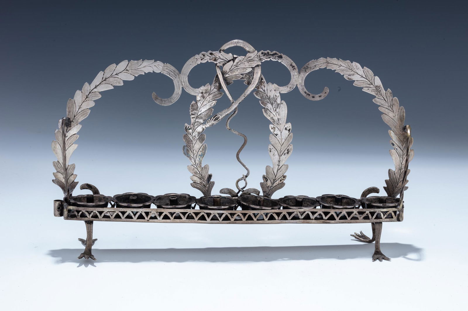 AN EXTREMELY RARE SNAKE MOTIF HANUKKAH LAMP. (1 of 1)