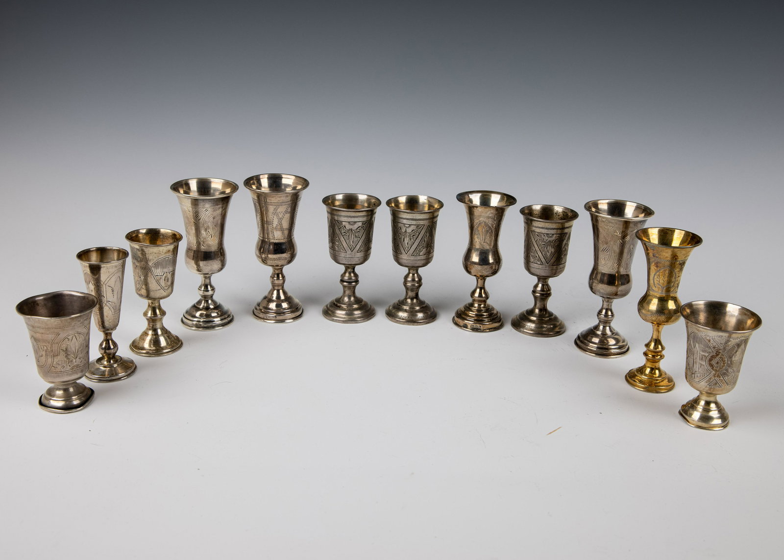 A LARGE GROUP OF 12 SOLID SILVER GOBLETS. (1 of 1)