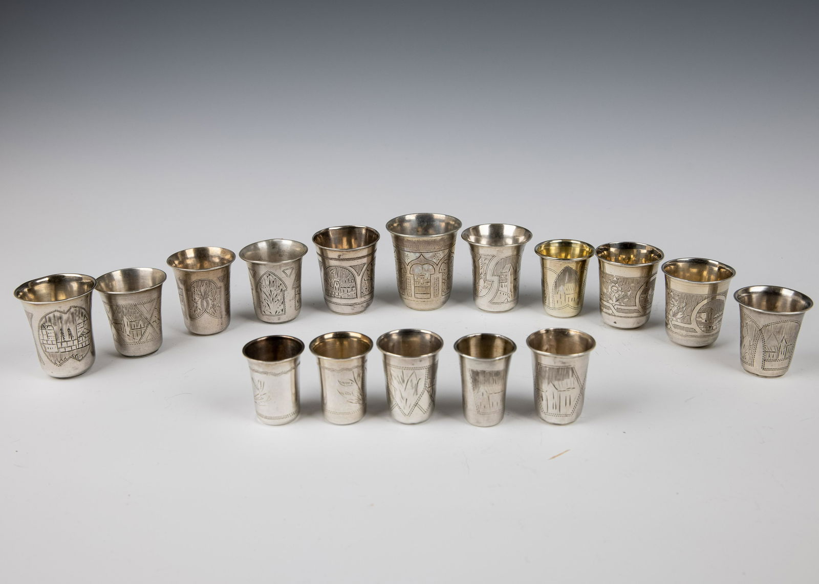 A LARGE GROUP OF 16 SOLID SILVER CUPS. (1 of 1)