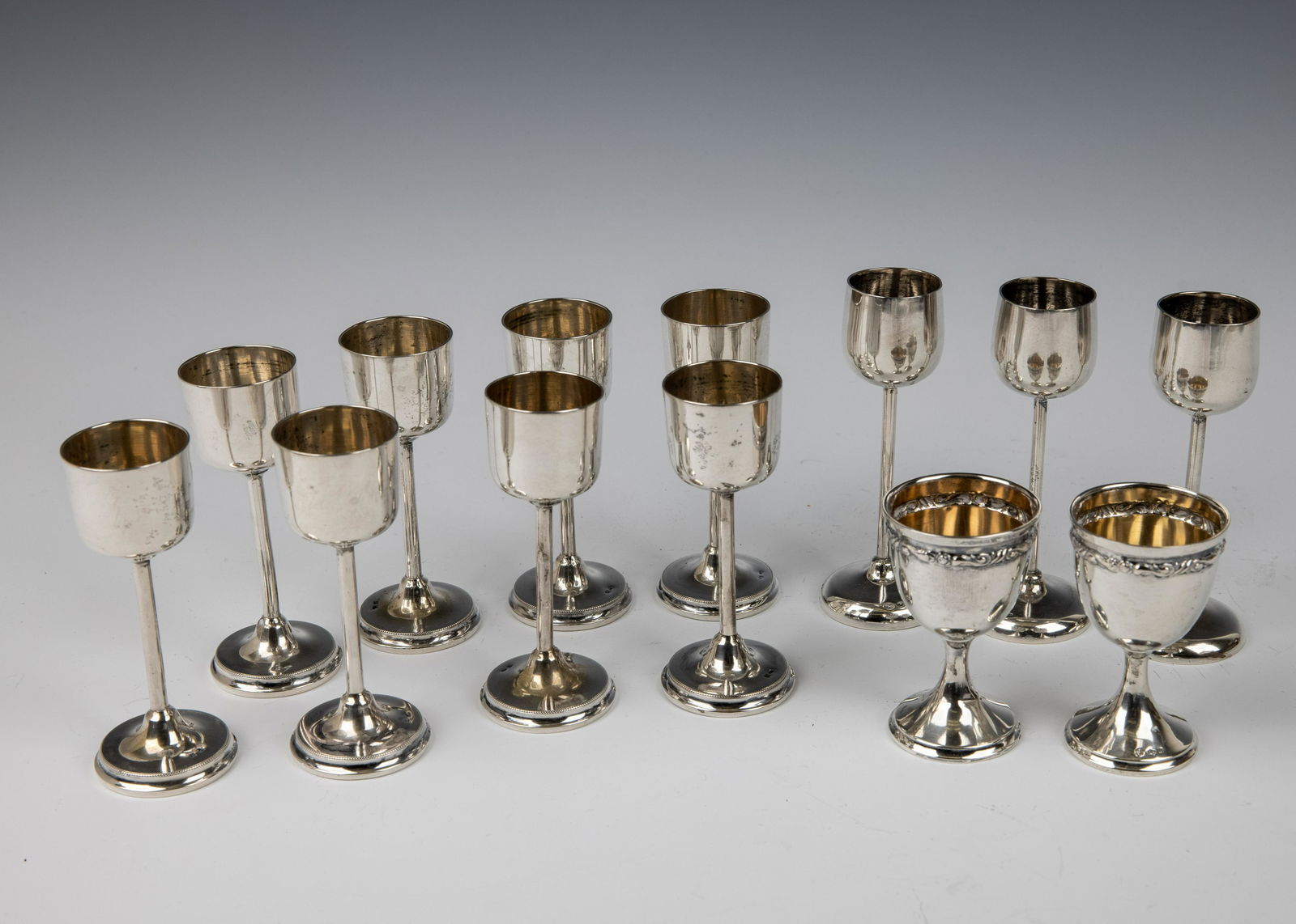 A GROUP OF 13 SOLID SILVER KIDDUSH GOBLETS (1 of 1)