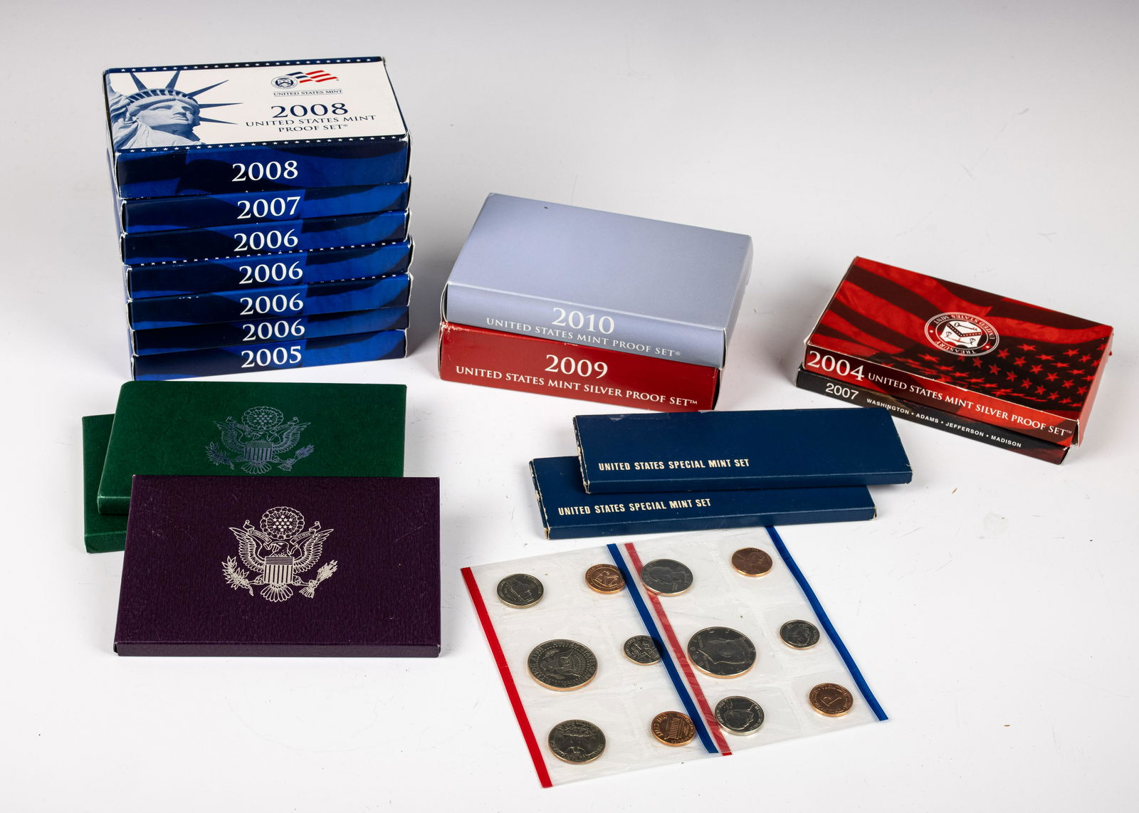 A COLLECTION OF UNITED STATES MINT PROOF SETS AND OTHER COINS (1 of 1)
