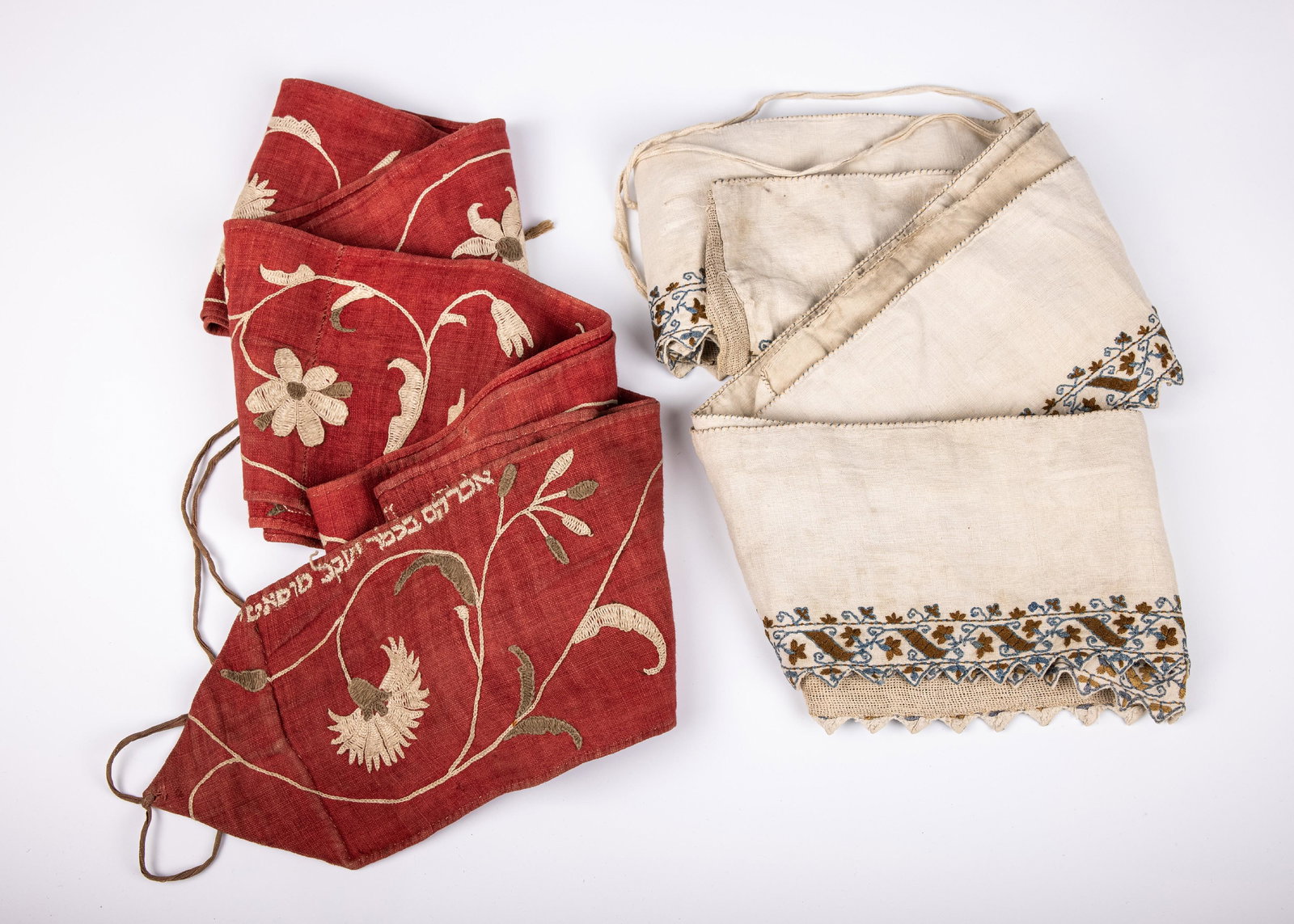 TWO EMBROIDERED TORAH WIMPLES. Germany, 19th century. On with Hebrew embroidery with a name. (1 of 1)