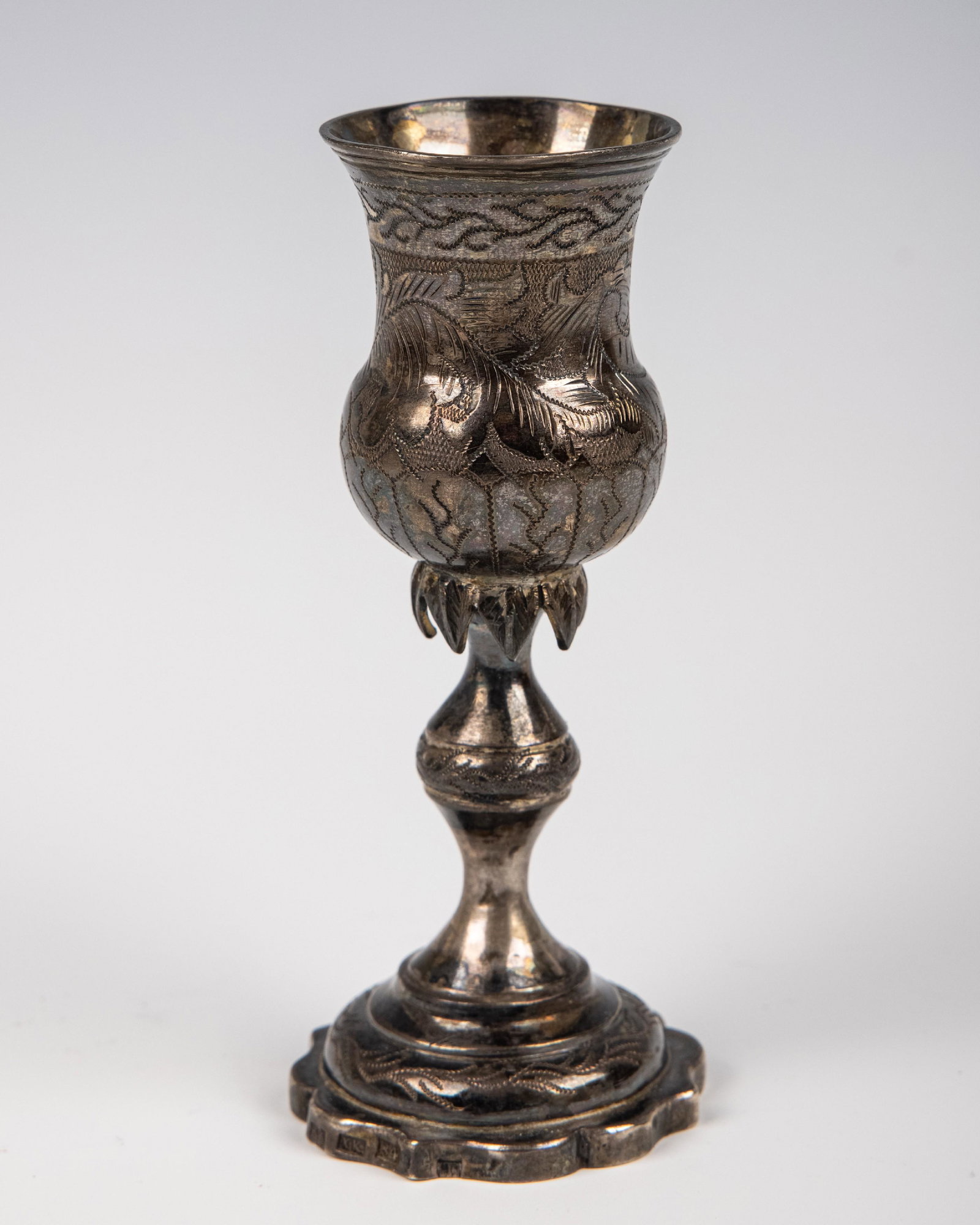A SILVER KIDDUSH GOBLET. Vilna, 19th century. Traditional form with skirted stem. 4.7" tall.: A SILVER KIDDUSH GOBLET. Vilna, 19th century. Traditional form with skirted stem. 4.7" tall.