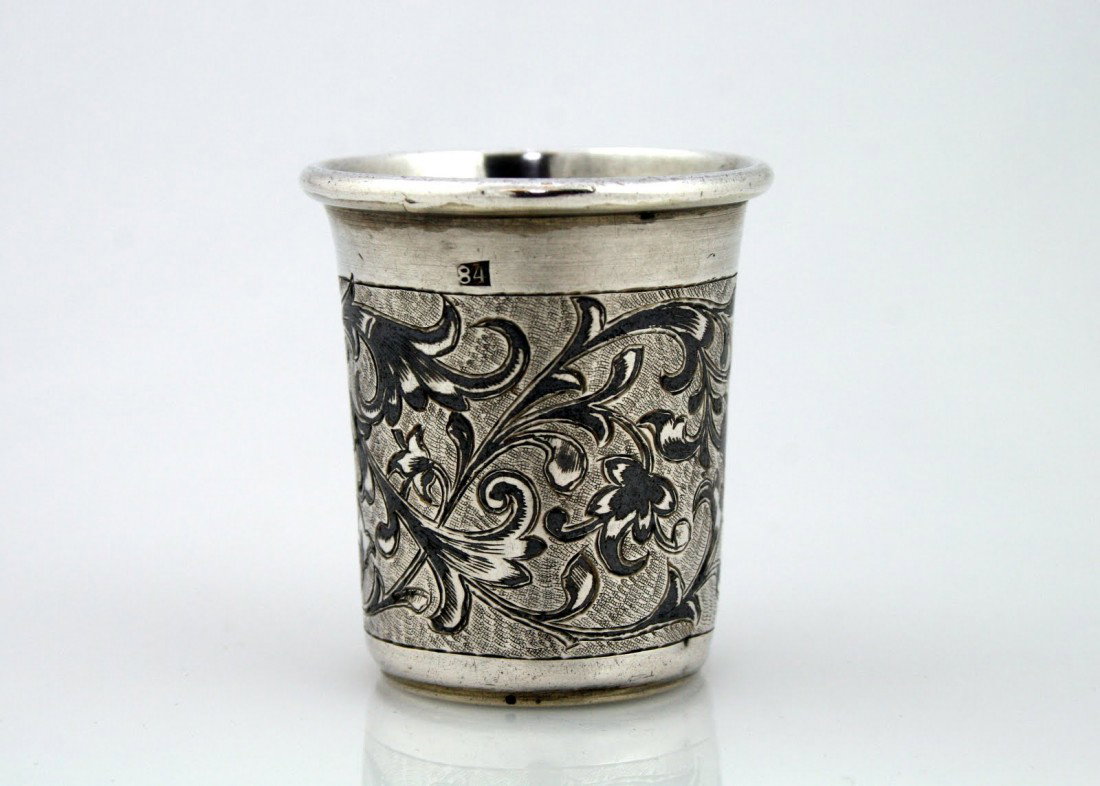 A SILVER NIELLO BEAKER. Russia, 1864.: A SILVER NIELLO BEAKER. Russia, 1864. Decorated with niello work and classic design. 1.8" tall.