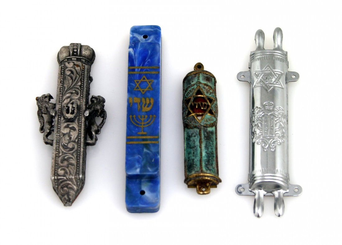 A GROUP OF FOUR MEZUZAHS. Of various sizes and ori: A GROUP OF FOUR MEZUZAHS. Of various sizes and origins.