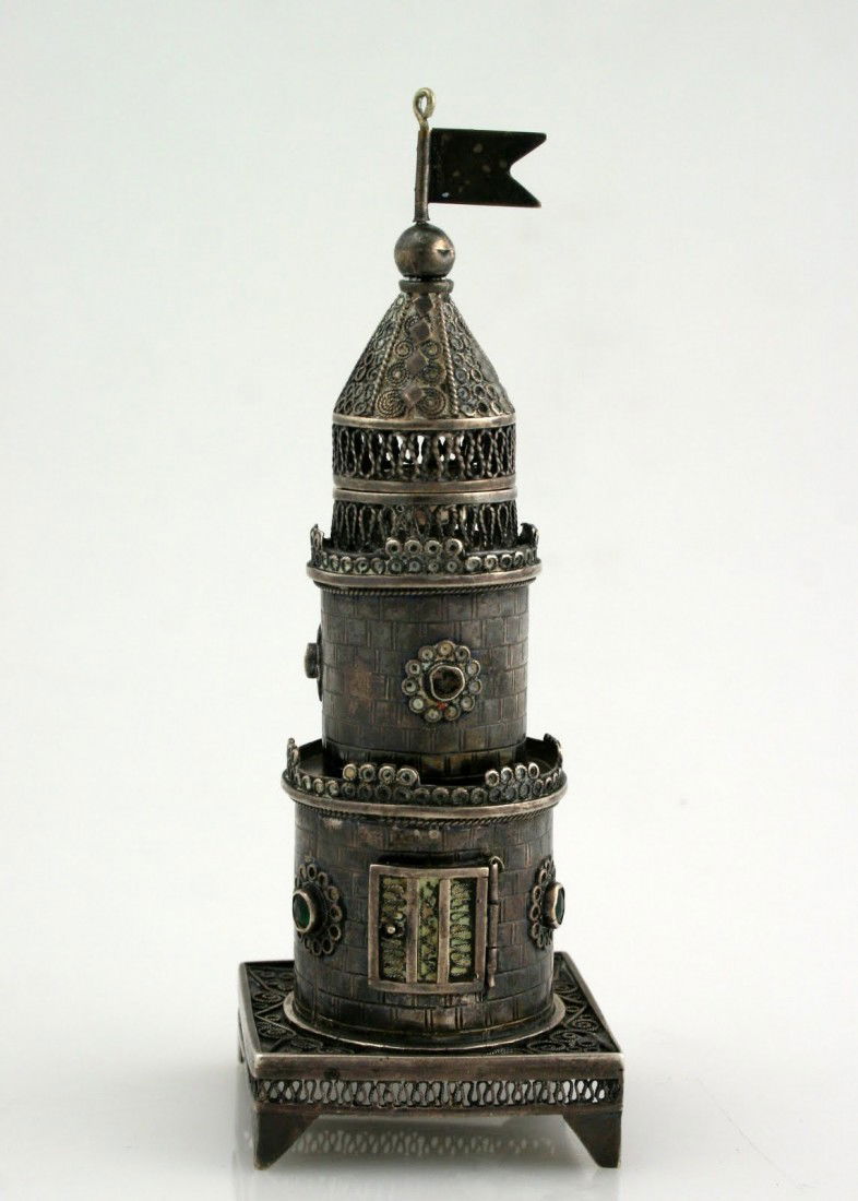 A SILVER SPICE TOWER. Israel, c.1950.: A SILVER SPICE TOWER. Israel, c.1950. On square filigree base. Decorated with colored glass applications (some now lacking) and brickwork design. Marked. 5.6” tall.