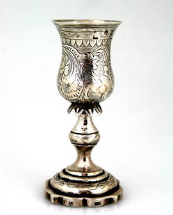 A SILVER KIDDUSH GOBLET. Vilna, c. 1870.: A SILVER KIDDUSH GOBLET. Vilna, c. 1870. With skirted stem. Marked. 4.4” tall.