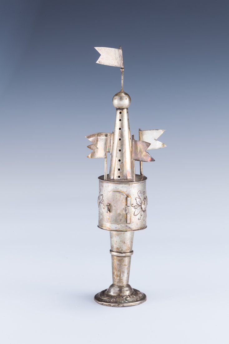 A SILVER SPICE TOWER. Germany, c. 1860.: A SILVER SPICE TOWER. Germany, c. 1860. On round chased base with barrel midsection, decorated with fruit bunches and five flags. 8.5” tall.