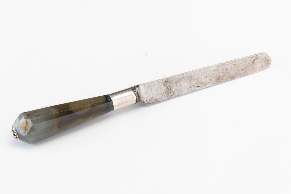 A SILVER BRIS KNIFE. Central Europe, 19th century.: A SILVER BRIS KNIFE. Central Europe, 19th century. With agate base and forged steel blade. 7” long.